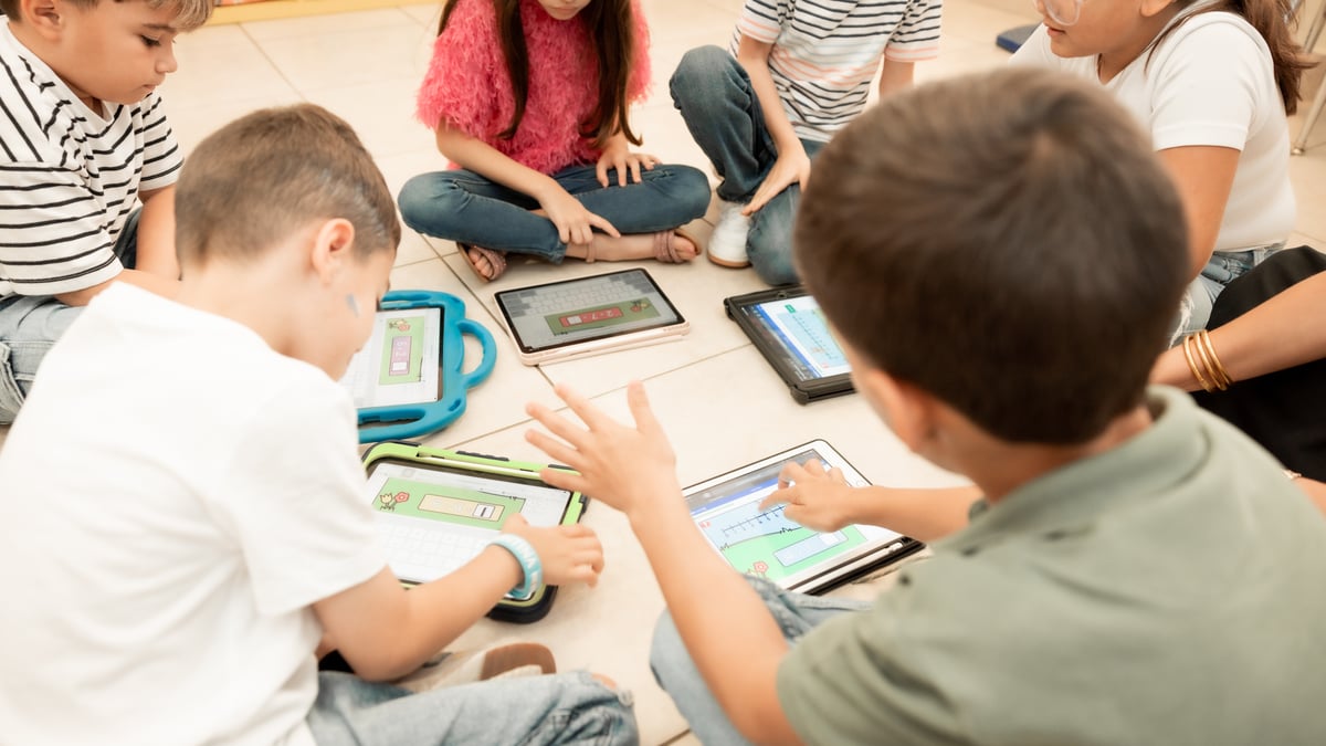 Students using Boom Cards on floor
